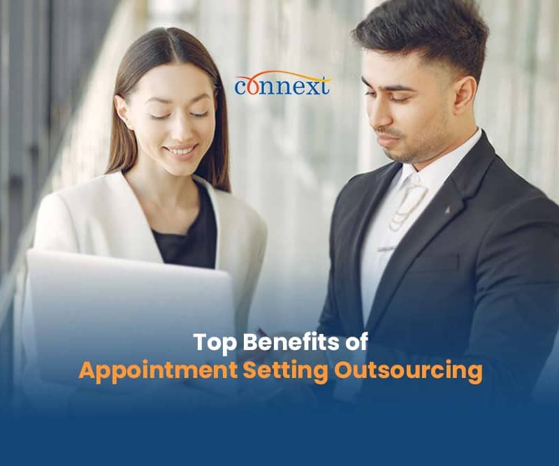 Top-Benefits-of-Appointment-Setting-Outsourcing-man-and-woman-holding-laptop-corporate-talking-1@1x_1