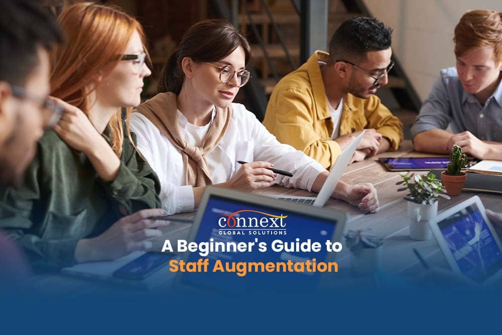 A Beginner's Guide to Staff Augmentation How It Works and Its Benefits 4 people working in desk office