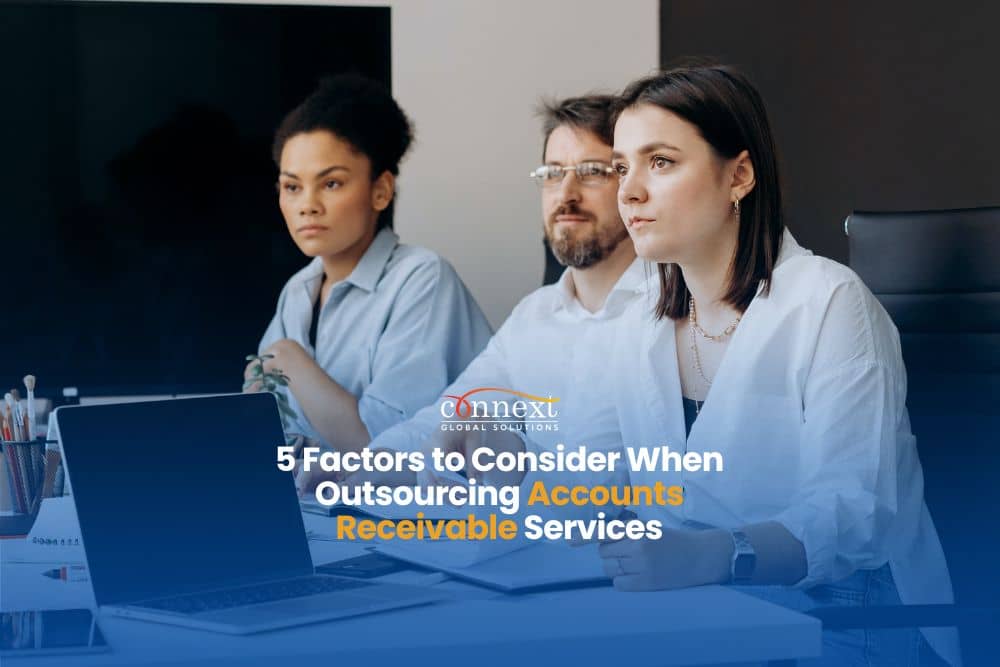 5 critical factors to consider when outsourcing Accounts Receivable services people with laptop in a meeting in an office