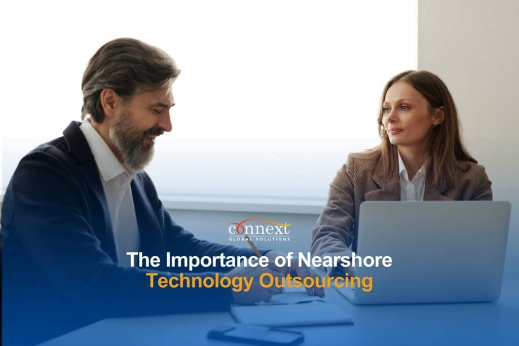the importance of Nearshore Technology Outsourcing man-and-woman-sitting-at-the-table-with-a-laptop-in-an-office