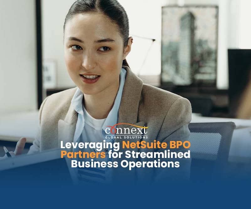 Leveraging-NetSuite-BPO-Partners-for-Streamlined-Business-Operations-woman-in-corporate-attire-working-with-computer-in-office-meeting-1@1x_1