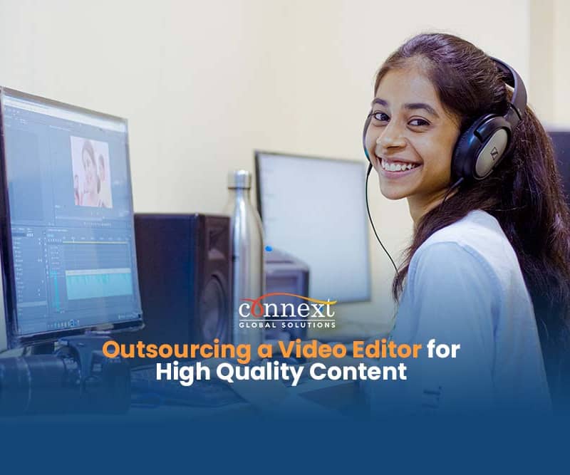 Outsourcing-a-Video-Editor-for-High-Quality-Content-girl-with-headphones-smiling-while-working-using-a-computer-in-office
