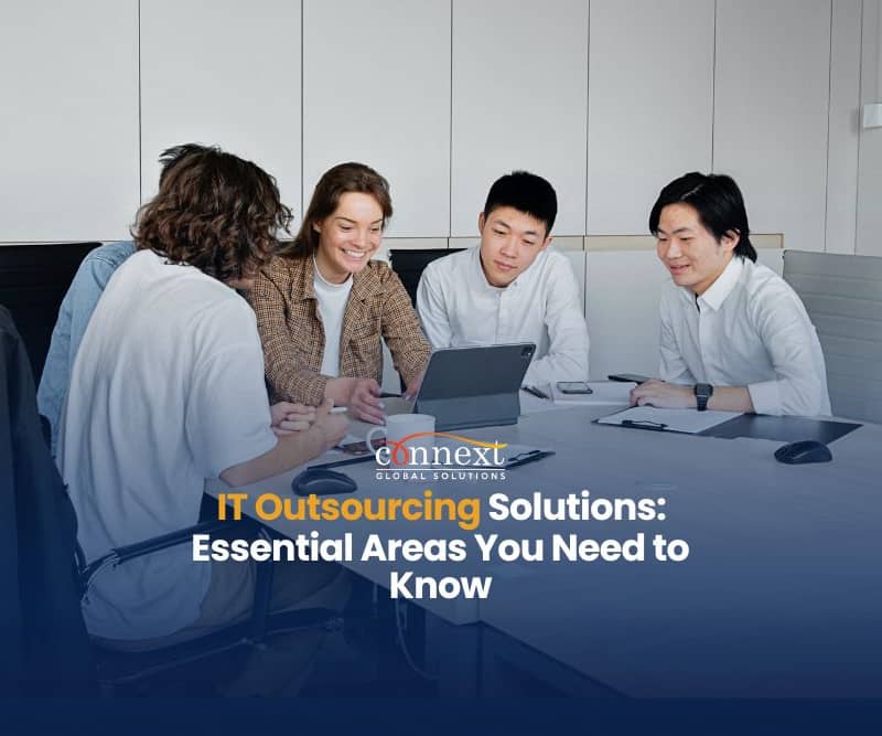 IT Outsourcing Solutions Essential Areas You Need to Know team meeting caucasian asian in corporate attire in office with tablet