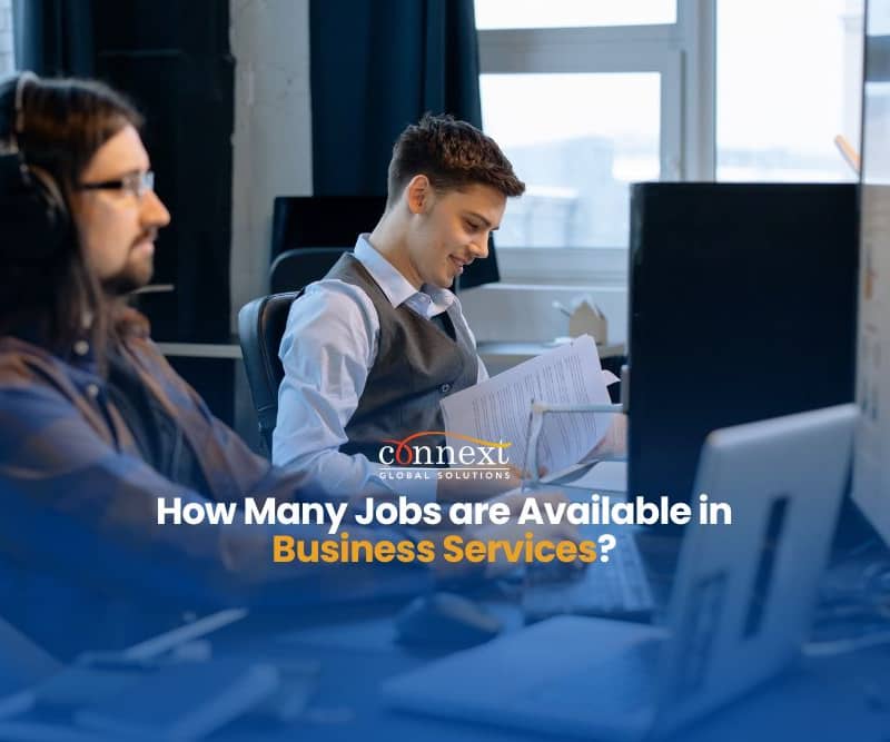 How-Many-Jobs-are-Available-in-Business-Services-men-in-corporate-attire-wearing-headset-with-papers-laptop-and-computer-in-office
