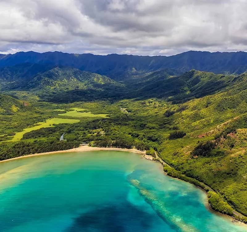 Aerial-view-Oahu-coastline-and-mountains-in-Honolulu-Hawaii-from-a-helicopter